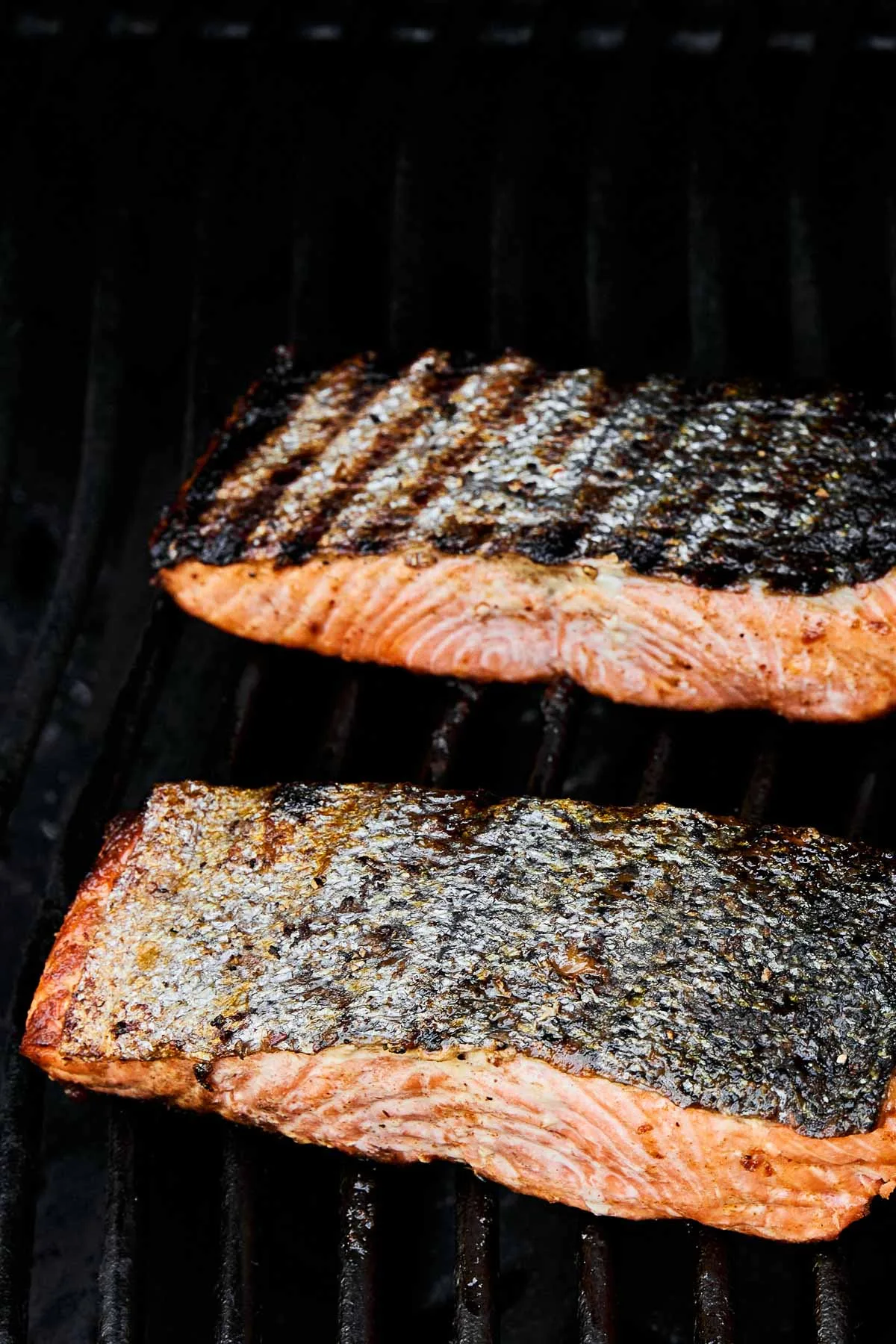 skin-on salmon fillet on grill grates